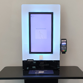 Photo of self-check machine with ezlink payment capability